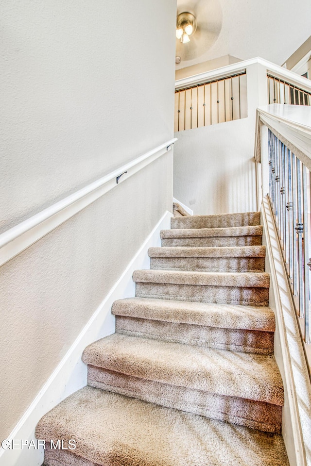 11352 Bullseye St, El Paso, TX 79934 - staircase featuring a textured wall