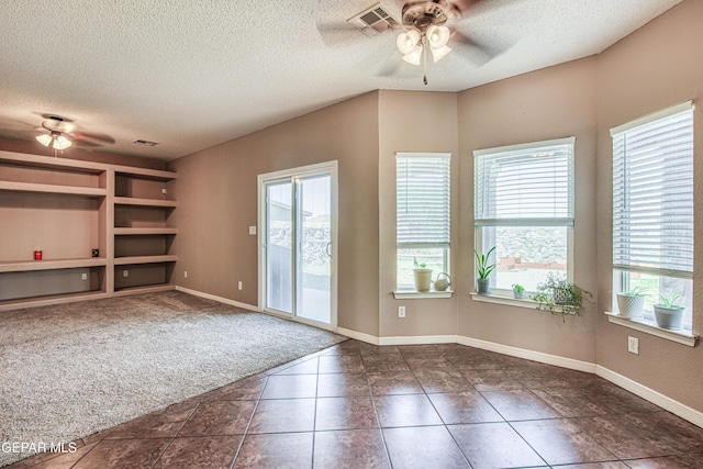 11352 Bullseye St, El Paso, TX 79934 - tiled empty room featuring a ceiling fan, a textured ceiling, plenty of natural light, and baseboards