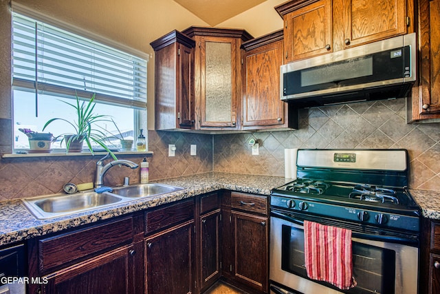 11352 Bullseye St, El Paso, TX 79934 - kitchen featuring stainless steel appliances, a sink, and decorative backsplash