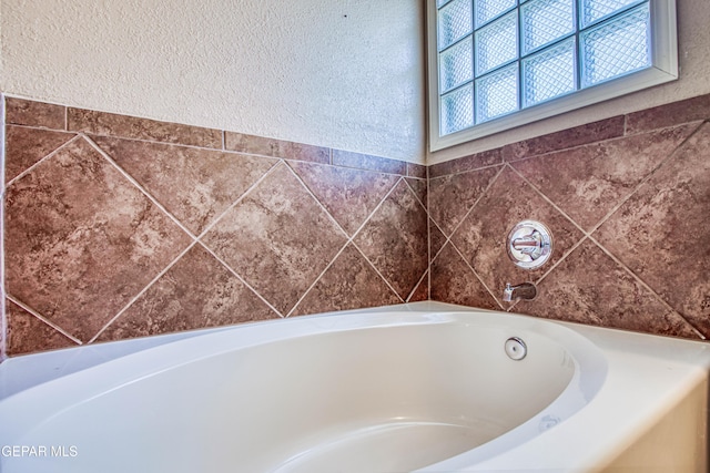 11352 Bullseye St, El Paso, TX 79934 - full bathroom featuring a bath and a textured wall