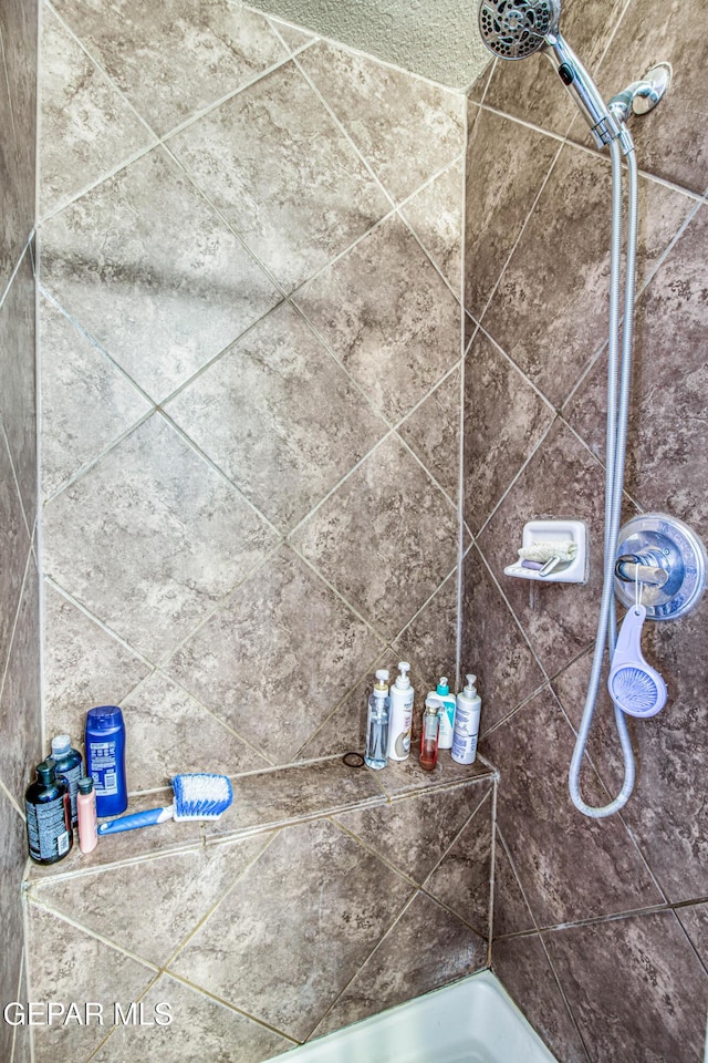 11352 Bullseye St, El Paso, TX 79934 - bathroom featuring a shower and a tub