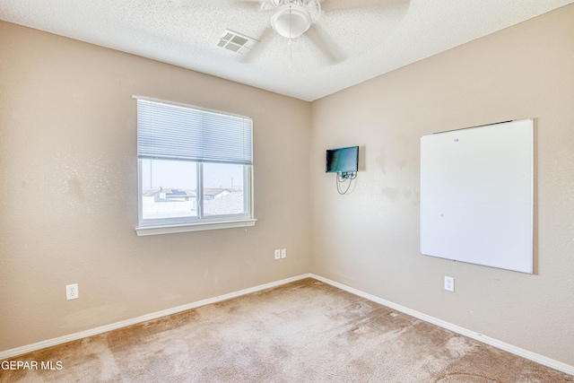 11352 Bullseye St, El Paso, TX 79934 - carpeted empty room with ceiling fan, baseboards, and a textured ceiling