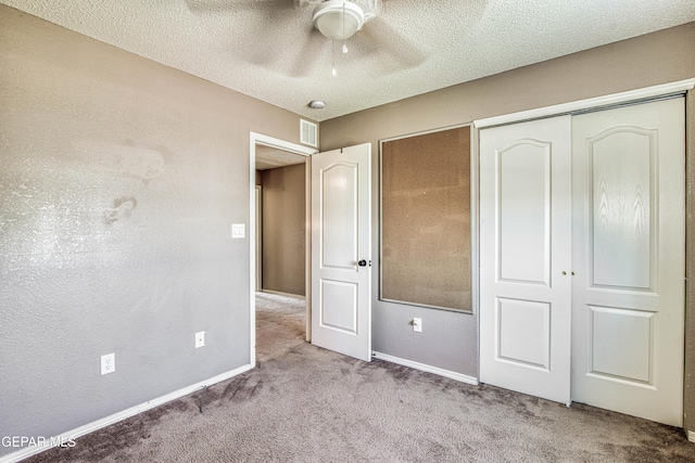 11352 Bullseye St, El Paso, TX 79934 - unfurnished bedroom with carpet, a textured ceiling, a closet, baseboards, and ceiling fan