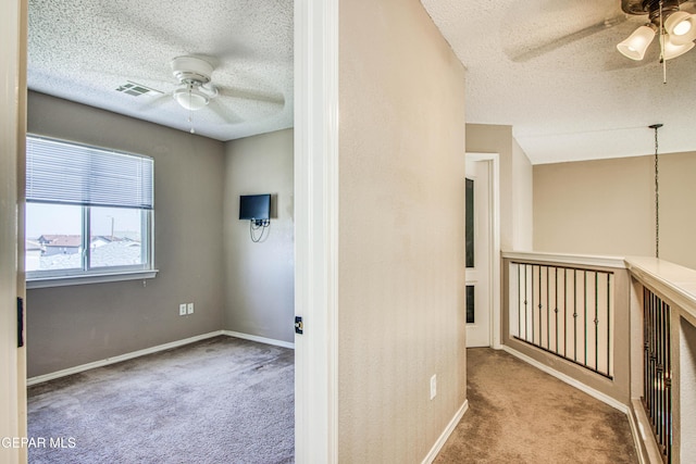 11352 Bullseye St, El Paso, TX 79934 - carpeted empty room with a ceiling fan, a textured ceiling, and baseboards