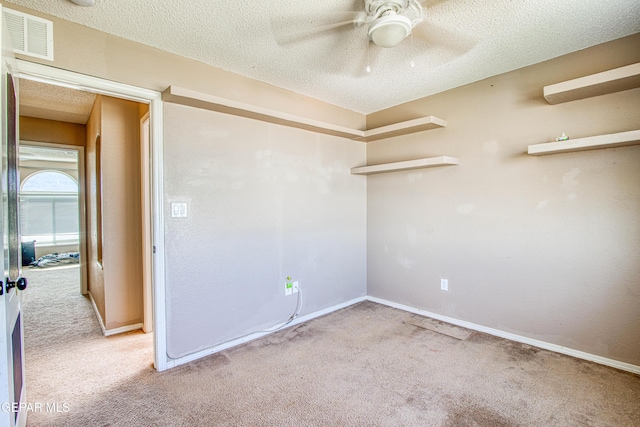 11352 Bullseye St, El Paso, TX 79934 - unfurnished room with carpet floors, a ceiling fan, a textured ceiling, and baseboards