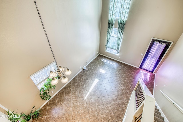 11352 Bullseye St, El Paso, TX 79934 - foyer entrance featuring baseboards and a towering ceiling