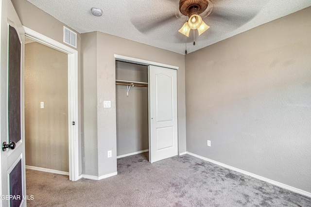 11352 Bullseye St, El Paso, TX 79934 - unfurnished bedroom with carpet flooring, a closet, a textured ceiling, baseboards, and ceiling fan