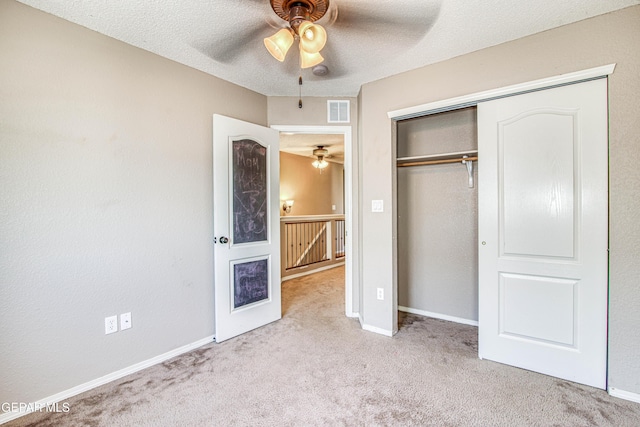 11352 Bullseye St, El Paso, TX 79934 - unfurnished bedroom with carpet, a closet, a textured ceiling, baseboards, and a ceiling fan
