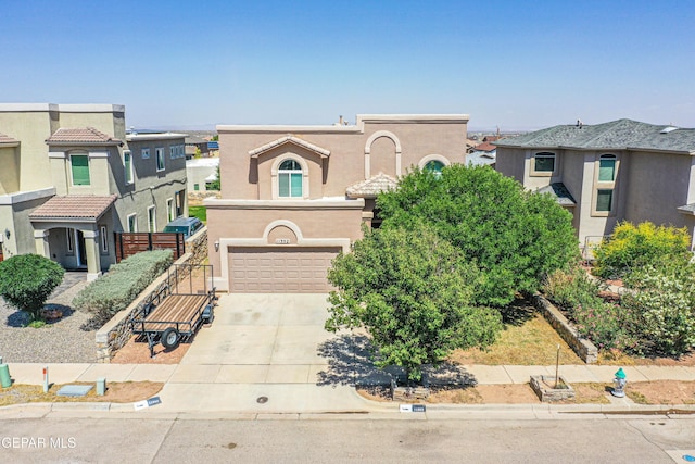 11352 Bullseye St, El Paso, TX 79934 - view of front of property with a garage, driveway, and stucco siding