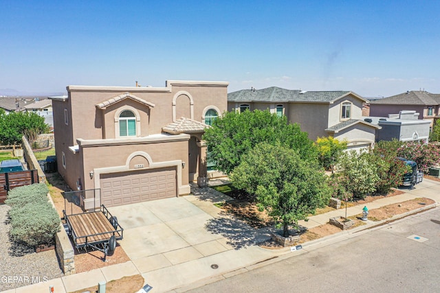 11352 Bullseye St, El Paso, TX 79934 - mediterranean / spanish-style home with driveway, stucco siding, and an attached garage