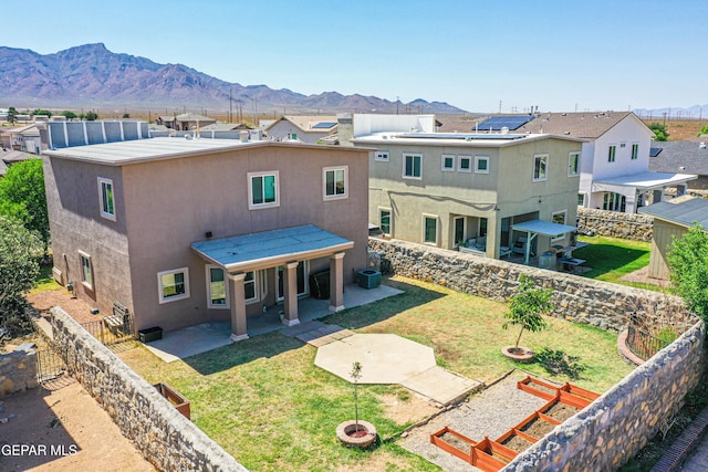 11352 Bullseye St, El Paso, TX 79934 - rear view of house with a patio, stucco siding, and a residential view