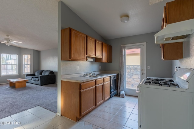 6224 Rhine Bridge Dr, El Paso, TX 79934 - kitchen featuring white gas range, vaulted ceiling, black dishwasher, open floor plan, and brown cabinets