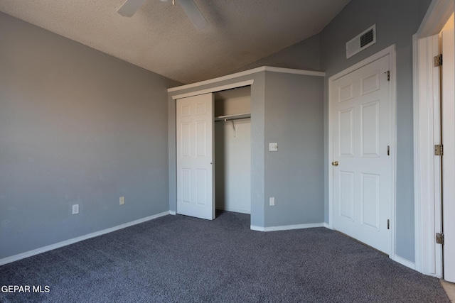 6224 Rhine Bridge Dr, El Paso, TX 79934 - unfurnished bedroom with dark colored carpet, a textured ceiling, ceiling fan, and a closet