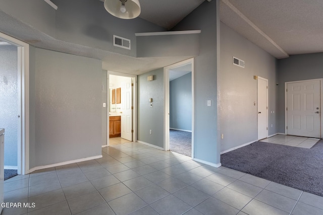 6224 Rhine Bridge Dr, El Paso, TX 79934 - tiled spare room with a towering ceiling