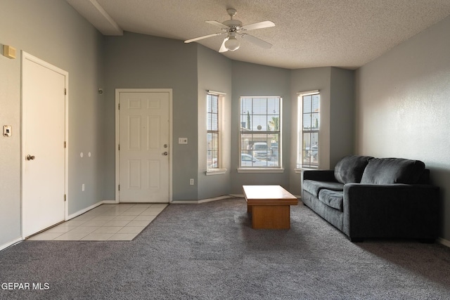 6224 Rhine Bridge Dr, El Paso, TX 79934 - foyer featuring carpet floors, a ceiling fan, a textured ceiling, lofted ceiling, and tile patterned flooring