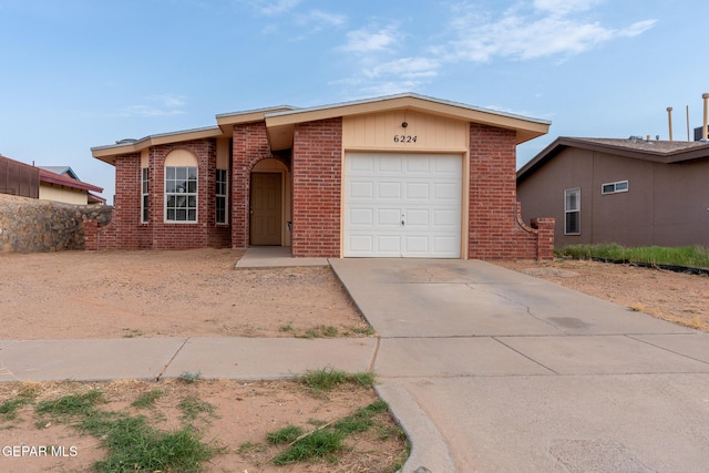 6224 Rhine Bridge Dr, El Paso, TX 79934 - view of front facade with a garage, brick siding, and concrete driveway