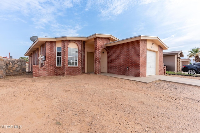 6224 Rhine Bridge Dr, El Paso, TX 79934 - view of front of property with an attached garage, concrete driveway, and brick siding