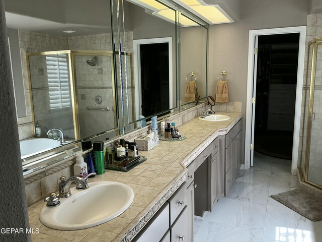 729 Cinnamon Teal Cir, El Paso, TX 79932 - full bath with double vanity, a shower stall, a spacious closet, and marble finish flooring