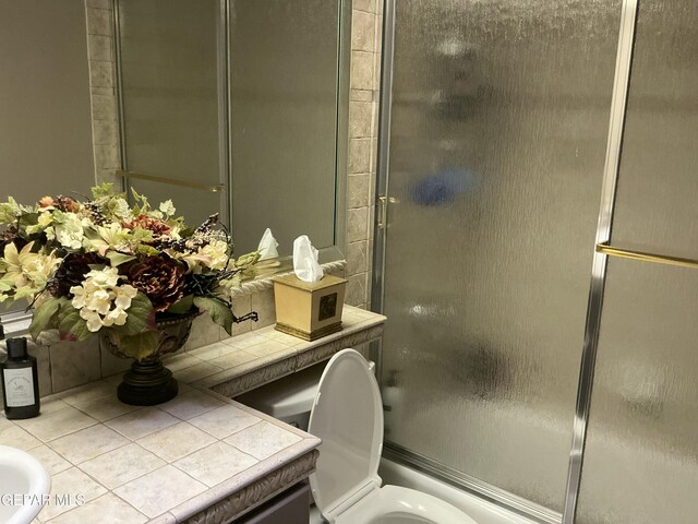 729 Cinnamon Teal Cir, El Paso, TX 79932 - full bath with vanity, toilet, combined bath / shower with glass door, and tile patterned flooring