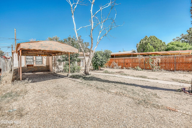124 N Toledo Pl, El Paso, TX 79905 - view of yard with a detached carport and gravel driveway