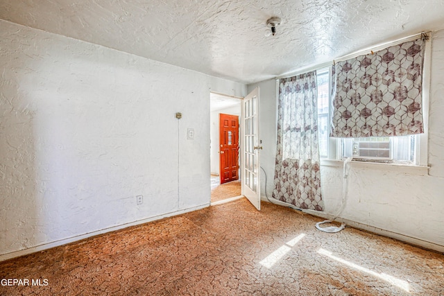 124 N Toledo Pl, El Paso, TX 79905 - spare room with a textured ceiling, a textured wall, and cooling unit