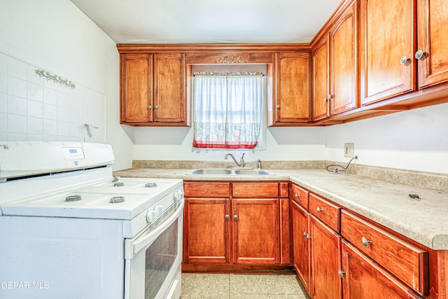 124 N Toledo Pl, El Paso, TX 79905 - kitchen featuring white electric range oven, a sink, and light countertops