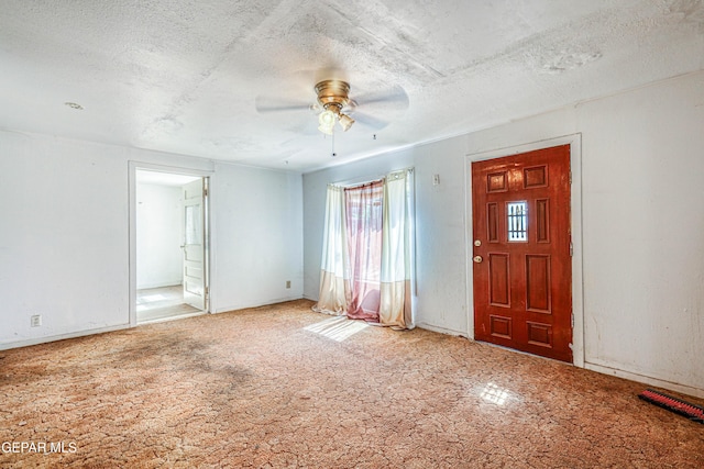 124 N Toledo Pl, El Paso, TX 79905 - foyer entrance featuring ceiling fan, a textured ceiling, and carpet flooring