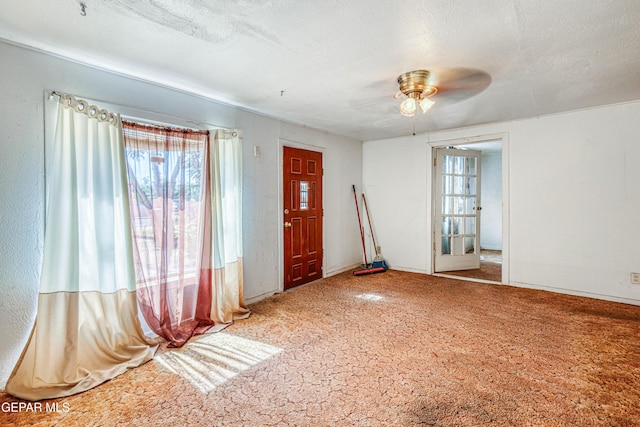 124 N Toledo Pl, El Paso, TX 79905 - carpeted foyer entrance with healthy amount of natural light, ceiling fan, and a textured ceiling