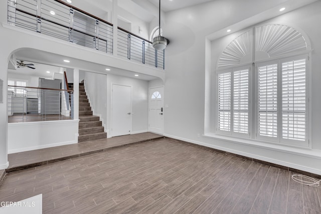 12055 Van Gogh Dr, El Paso, TX 79936 - entrance foyer with a ceiling fan, baseboards, wood finished floors, stairs, and recessed lighting