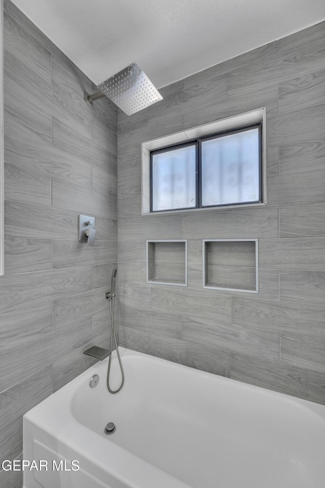 12055 Van Gogh Dr, El Paso, TX 79936 - bathroom with healthy amount of natural light and shower / tub combination