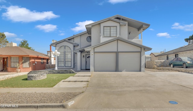 12055 Van Gogh Dr, El Paso, TX 79936 - view of front of home with driveway and a garage