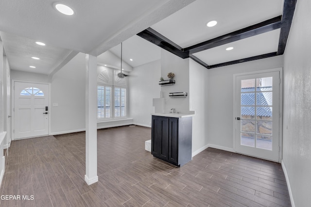 12055 Van Gogh Dr, El Paso, TX 79936 - kitchen with baseboards, healthy amount of natural light, dark cabinets, light countertops, and recessed lighting
