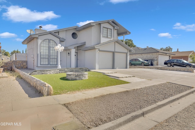 12055 Van Gogh Dr, El Paso, TX 79936 - view of front facade featuring concrete driveway, a front lawn, a garage, and brick siding