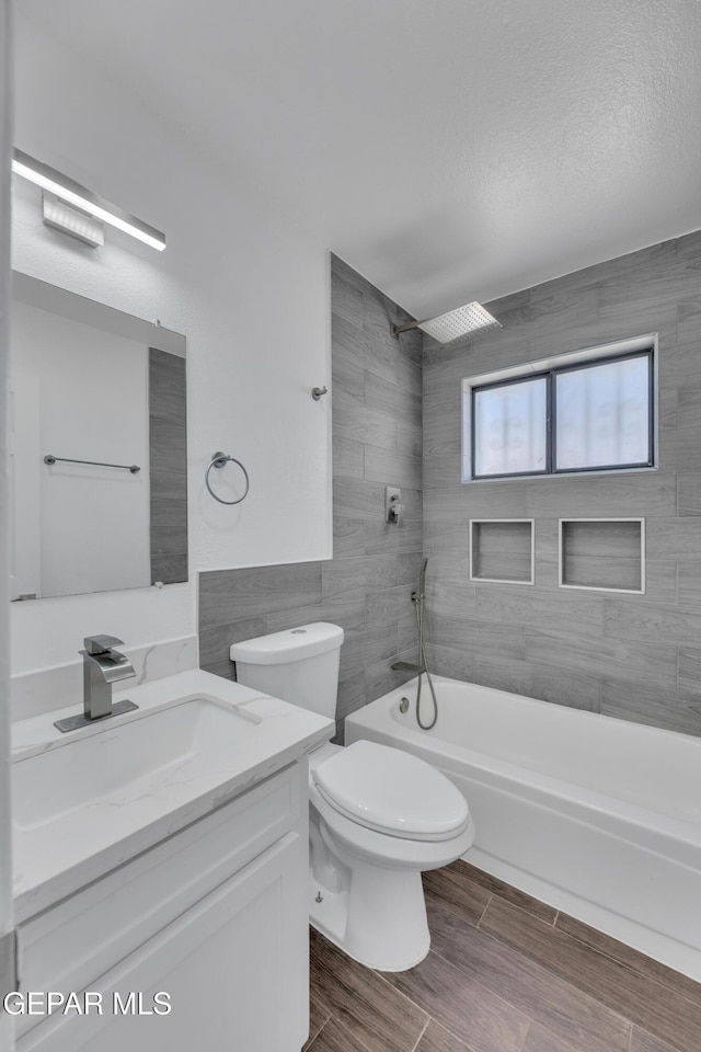 12055 Van Gogh Dr, El Paso, TX 79936 - full bath with  shower combination, vanity, toilet, and wood finished floors