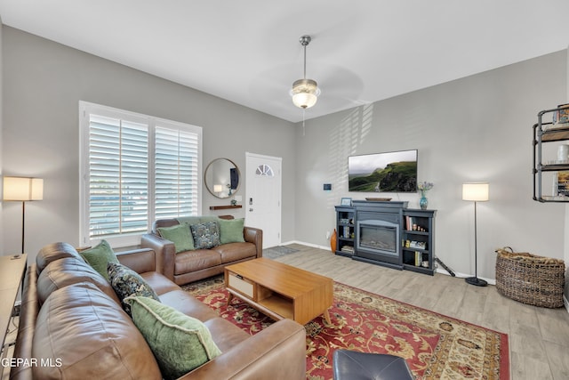 13936 Garforth Ave, El Paso, TX 79928 - living area with wood finished floors, ceiling fan, and baseboards