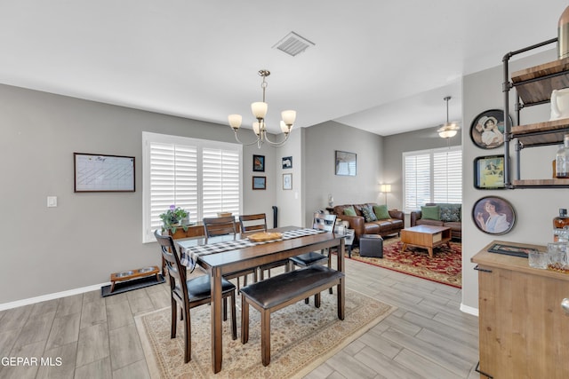 13936 Garforth Ave, El Paso, TX 79928 - dining space with a chandelier, wood finish floors, and baseboards