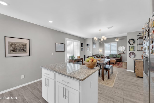 13936 Garforth Ave, El Paso, TX 79928 - kitchen with baseboards, a chandelier, light wood finished floors, white cabinetry, and recessed lighting