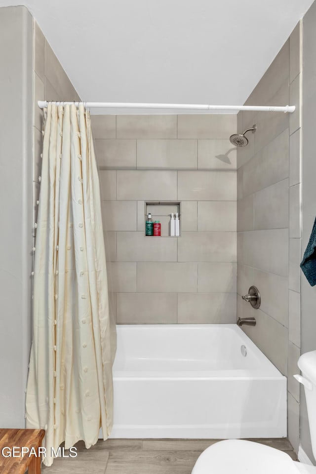 13936 Garforth Ave, El Paso, TX 79928 - full bath featuring shower / bath combination with curtain, toilet, and wood finished floors