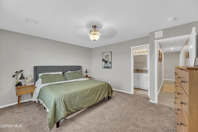 13936 Garforth Ave, El Paso, TX 79928 - carpeted bedroom with baseboards, connected bathroom, a ceiling fan, and a sink