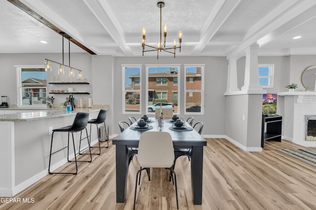 2729 Pershing Dr, El Paso, TX 79903 - dining room with baseboards, light wood-style flooring, a fireplace, beamed ceiling, and coffered ceiling