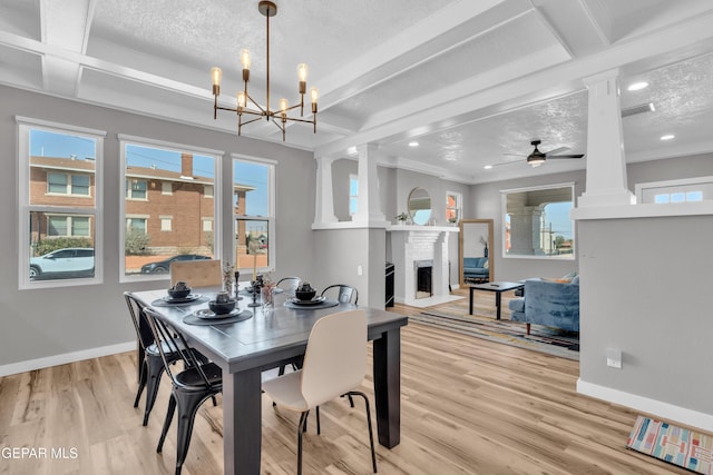 2729 Pershing Dr, El Paso, TX 79903 - dining space featuring beam ceiling, baseboards, ornate columns, light wood finished floors, and a fireplace