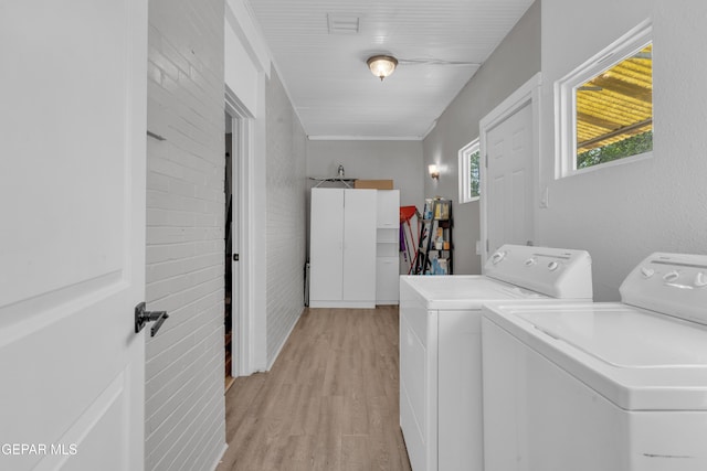 2729 Pershing Dr, El Paso, TX 79903 - laundry area featuring washer and clothes dryer and light wood-style floors