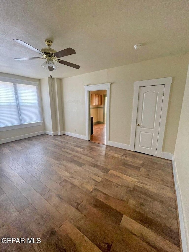 2526 Yandell Dr, El Paso, TX 79903 - spare room featuring wood-type flooring, ceiling fan, and baseboards