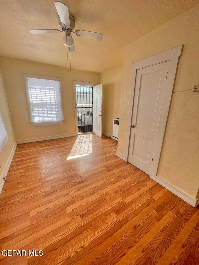 2526 Yandell Dr, El Paso, TX 79903 - spare room with light wood-type flooring, baseboards, and a ceiling fan