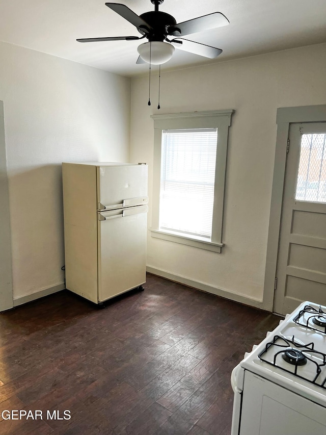 2526 Yandell Dr, El Paso, TX 79903 - kitchen with white appliances, ceiling fan, dark wood finished floors, and baseboards