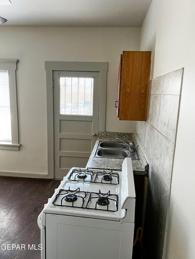 2526 Yandell Dr, El Paso, TX 79903 - kitchen with white range with gas cooktop, a sink, plenty of natural light, and dark wood-style floors