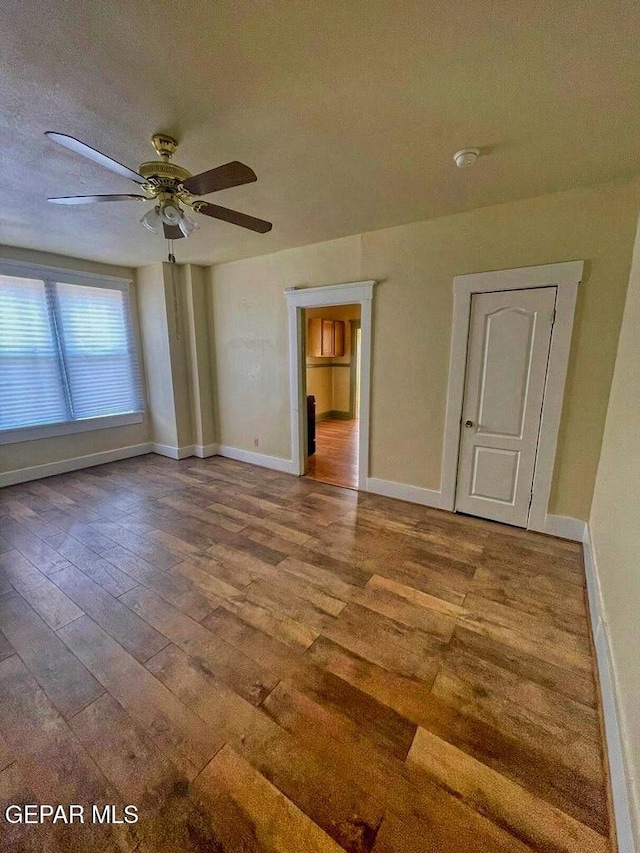 2526 Yandell Dr, El Paso, TX 79903 - unfurnished room featuring hardwood / wood-style floors, ceiling fan, baseboards, and a textured ceiling