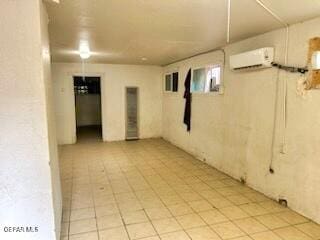 2526 Yandell Dr, El Paso, TX 79903 - below grade area with an AC wall unit and light tile patterned floors