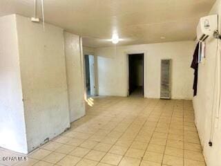 2526 Yandell Dr, El Paso, TX 79903 - empty room featuring an AC wall unit and light tile patterned floors