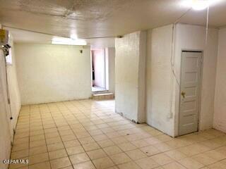 2526 Yandell Dr, El Paso, TX 79903 - below grade area featuring light tile patterned flooring